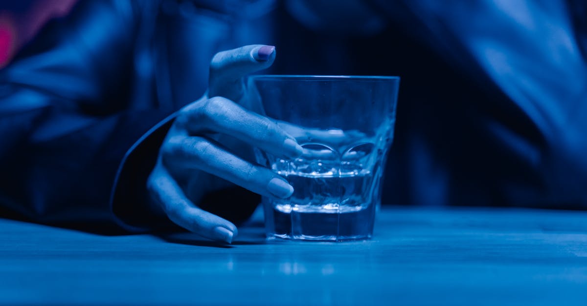 What are the consequences of excessive drinking? - Person Holding Clear Drinking Glass