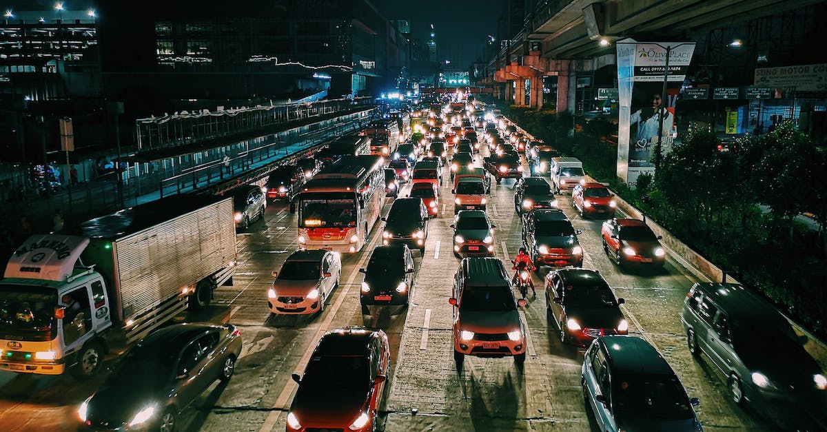 What are the consequences of not caring about traffic jams? - Photo of Vehicles On Road During Evening