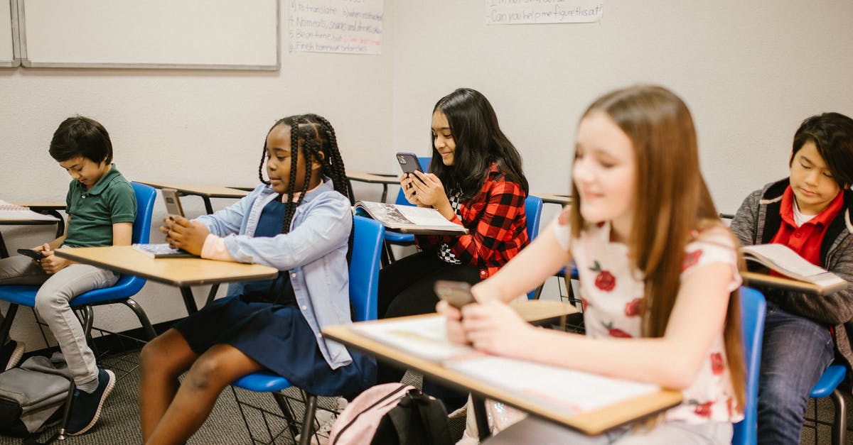 What are the consequences of using nuclear weapons against pirates or barbarians? - Students Sitting Inside the Classroom While Using Their Smartphone