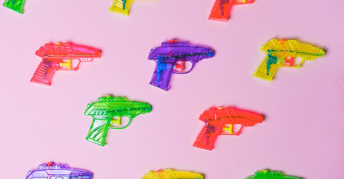 What are the consequences of using nuclear weapons against pirates or barbarians? - Top view of various multicolored toys for fight arranged on pink background as representation of game