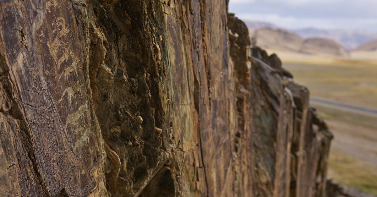 What are the differences between Civilization 5: GOTY Edition and the Complete Edition? - Mountain surface with ancient petroglyphic drawings