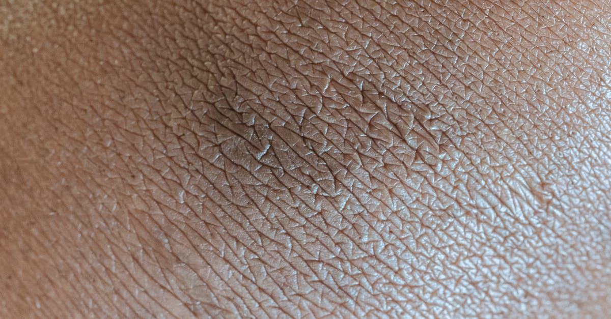 What are the differences between regular and Hardcore? - Textured background of skin surface with linear pattern and pigmentation spot in center What are the differences between regular and Hardcore? - Textured background of skin surface with linear pattern and pigmentation spot in center
