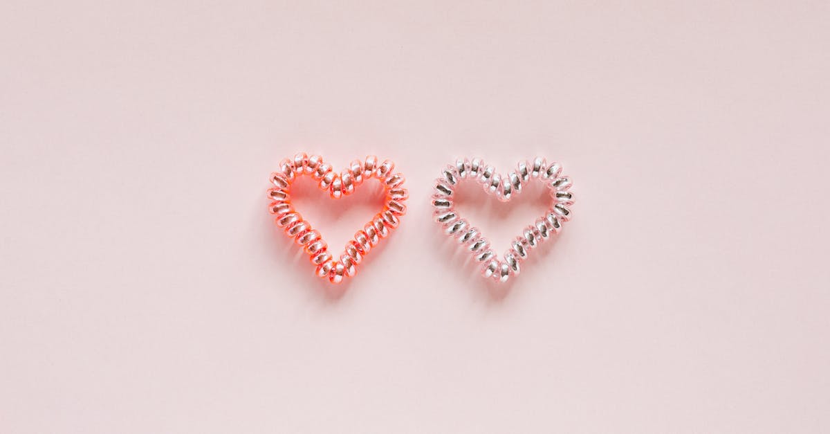 What are the differences between ships in Battlefront (x-wing, a-wing, tie, tie interceptor) - From above of pair of small brilliant hearts made of elastic hair ties on pale pink surface