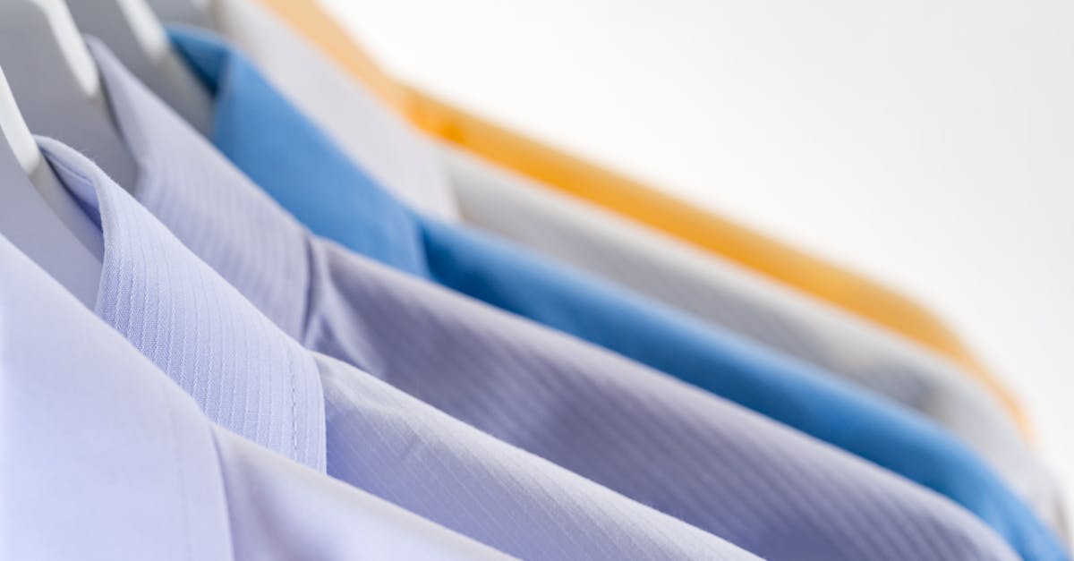 What are the different wake ups, and how do I select them? - Details of various stylish formal shirts hanging in row on rack against white background
