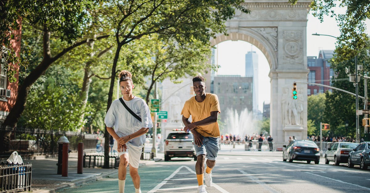 What are the hotkeys to move units? - Full body of serious multiethnic male skateboarders riding skateboards along road against Triumphal Arch in New York