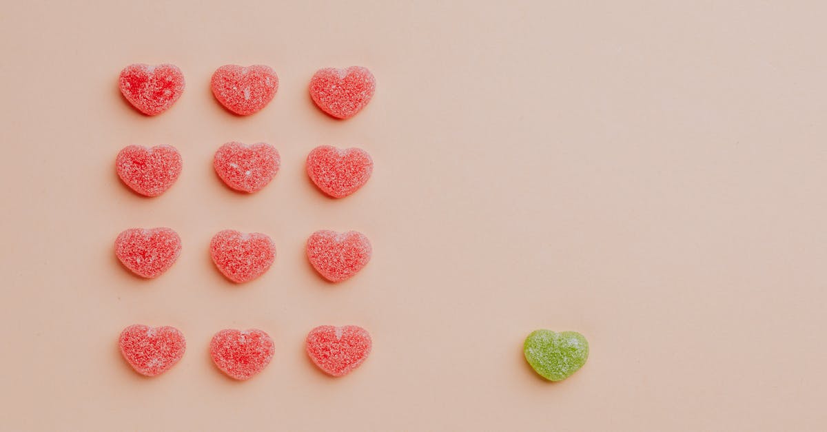 What are the individual Color Ids? - Flat lay composition of rows of delicious fruit jellies hearts placed on pink background