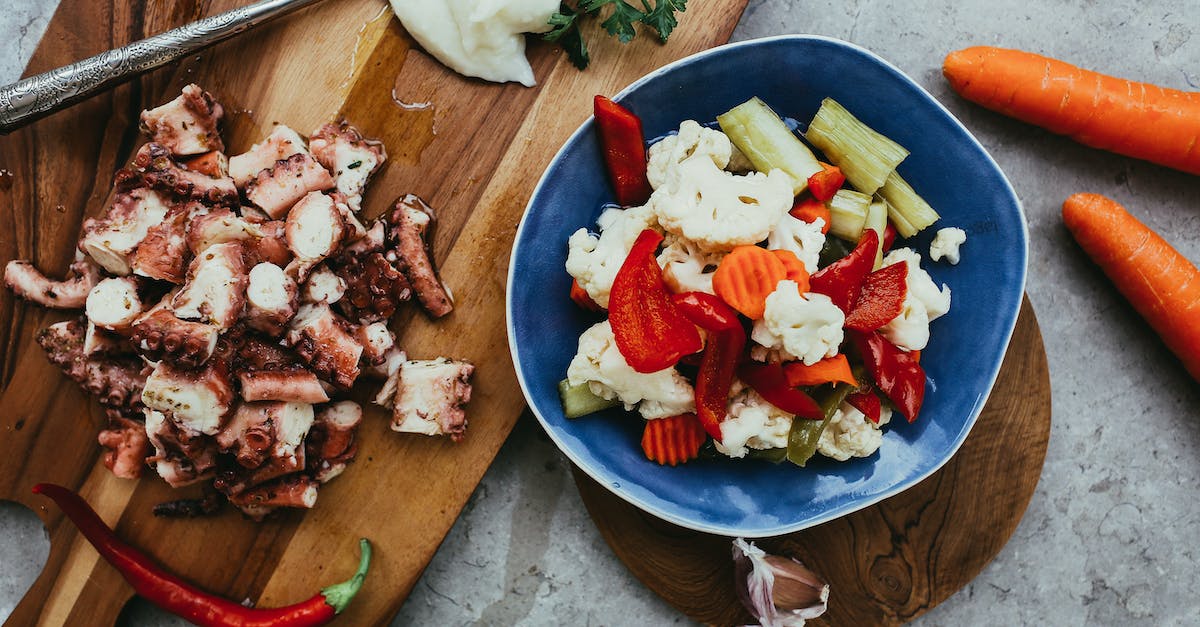 What are the laws of squid ink? - Fresh Vegetables in Bowl Next to Diced Squid What are the laws of squid ink? - Fresh Vegetables in Bowl Next to Diced Squid