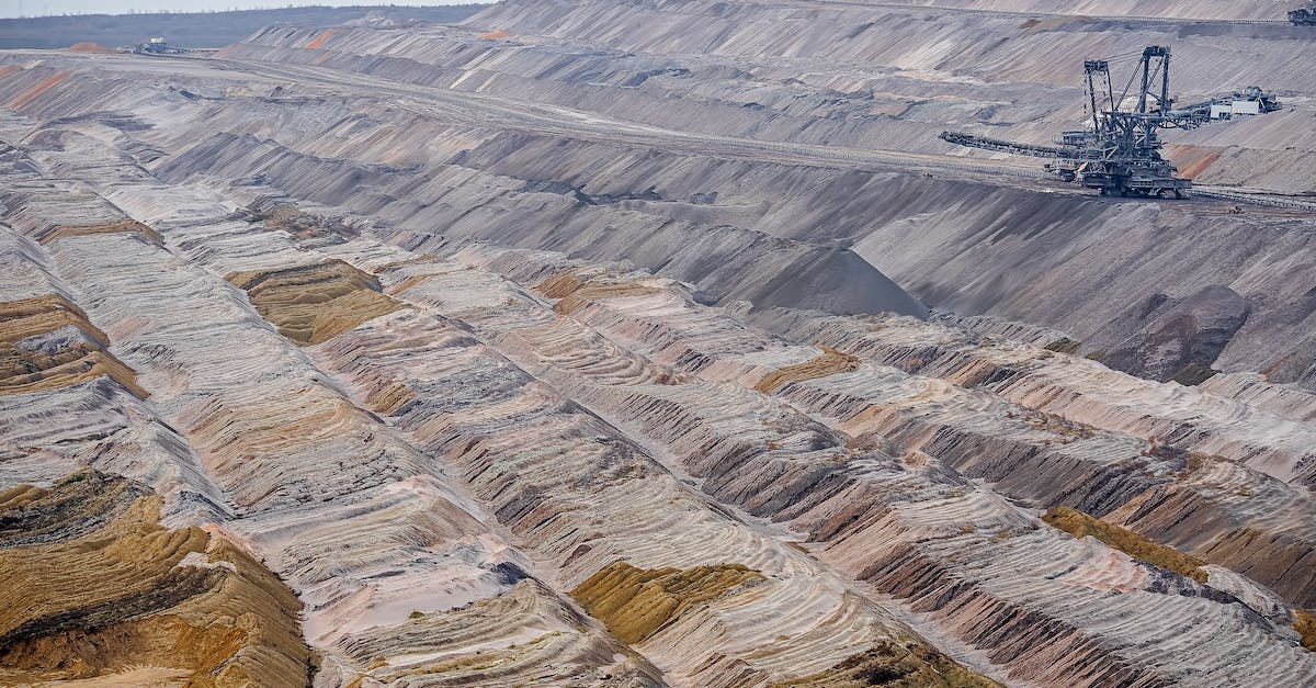 What are the major levels for Mining? - Barren Landscape with Terrain Levels and Cranes What are the major levels for Mining? - Barren Landscape with Terrain Levels and Cranes