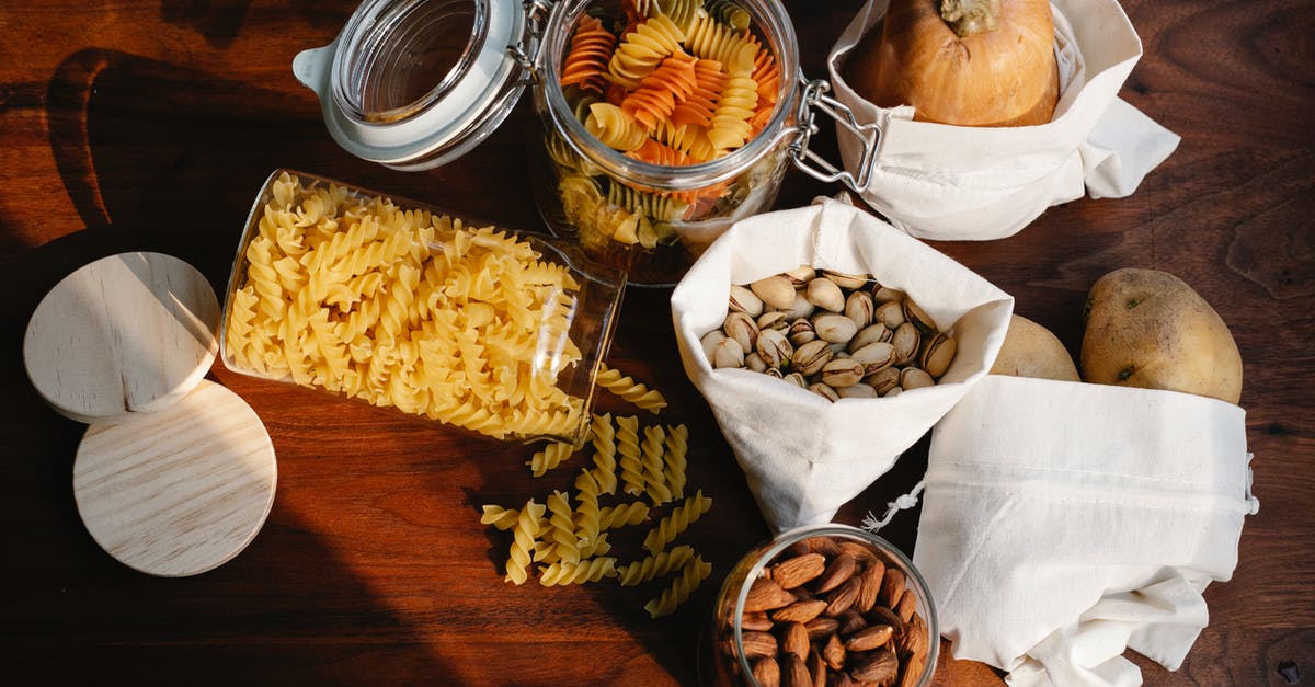 What are the maximum bag space and Pokemon storage? How many upgrades are needed to reach the limits? - Top view jars of raw pasta placed on wooden table near ECO friendly sacks with pistachios and almonds near pumpkin and potatoes