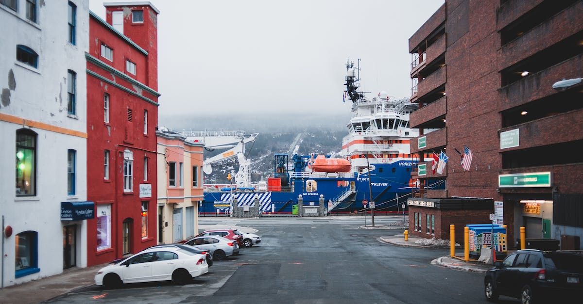 What are the maximum levels for the different ship types? - Contemporary many automobiles on gray asphalt road with urban buildings near large river port