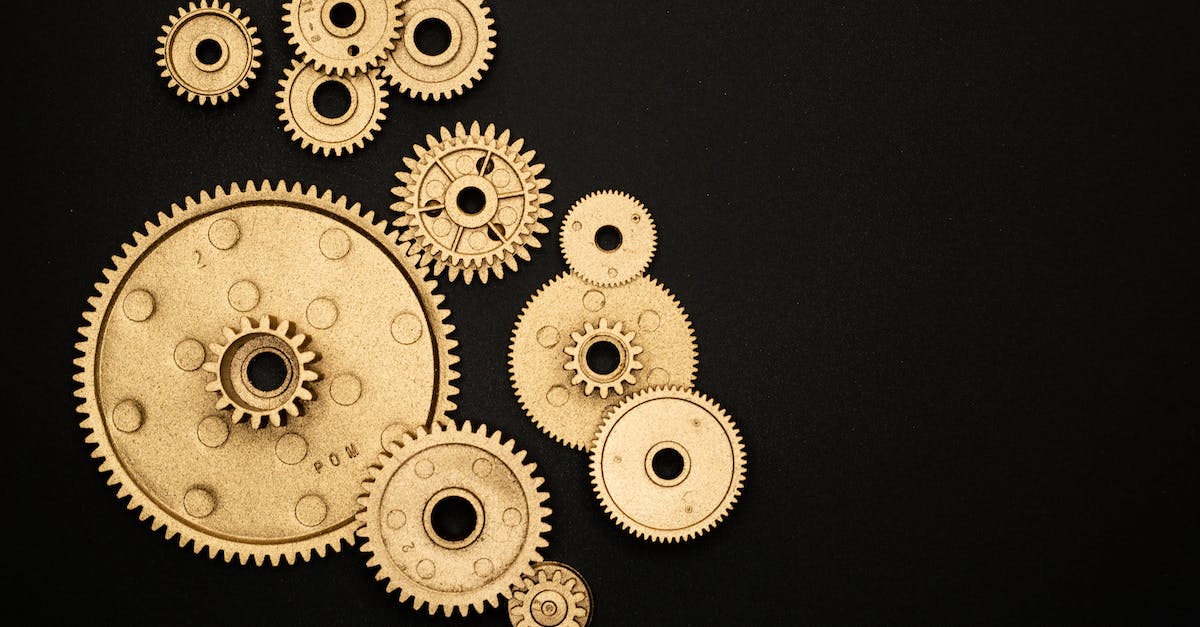 What Are The Mechanics For Attack-Move - Photo of Golden Cogwheel on Black Background