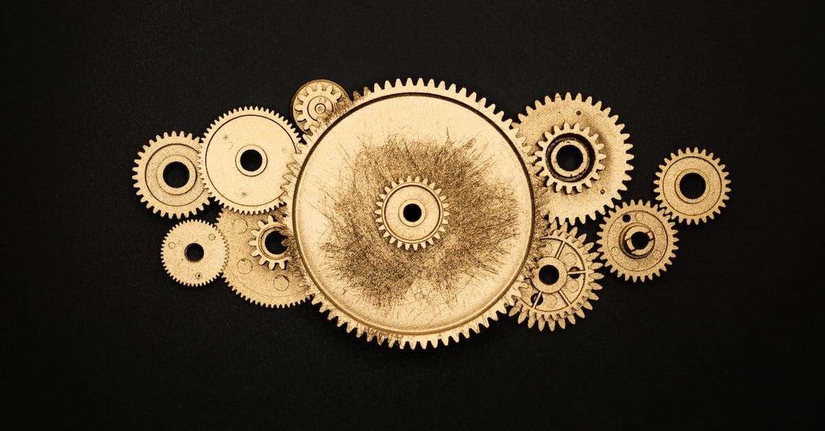 What Are The Mechanics For Attack-Move - Photo of Golden Cogwheel on Black Background