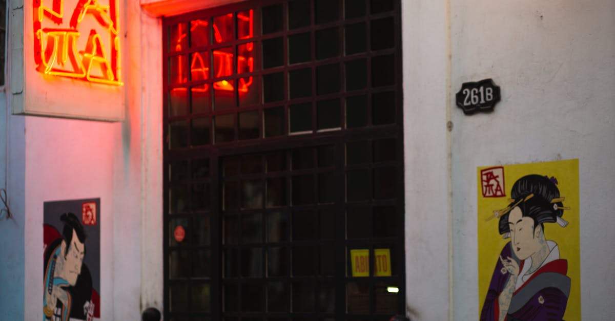What are the numbers on the character descriptions? - Door of old building with graffiti on walls