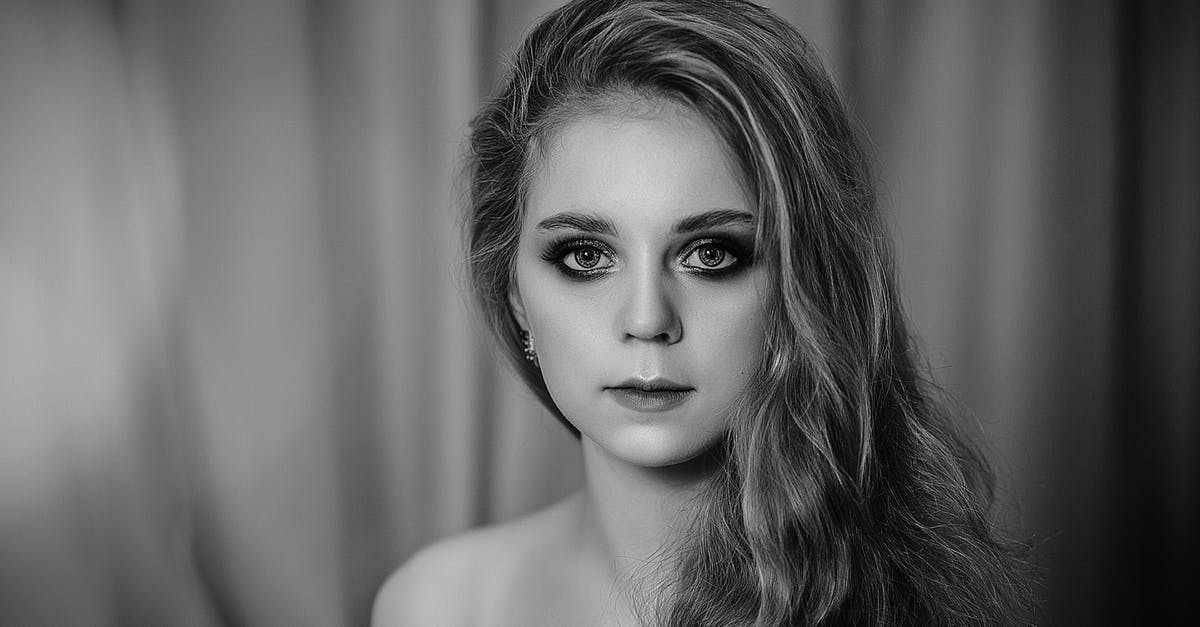 What are the odds of getting a Pokemon with perfect/max stats in Generation I? - Black and white of youthful attractive woman with expressive makeup and bare shoulders looking at camera on blurred background