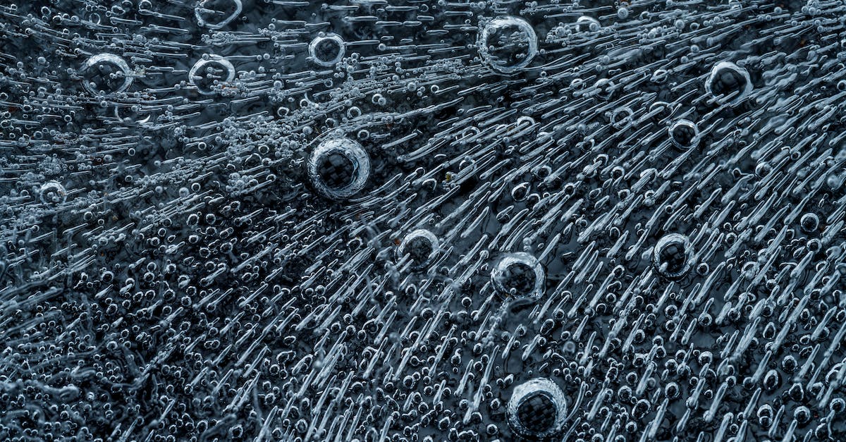 What are the patterns for the animals in the different areas? - Macro shot of bird feather with interesting texture containing droplets and short lines