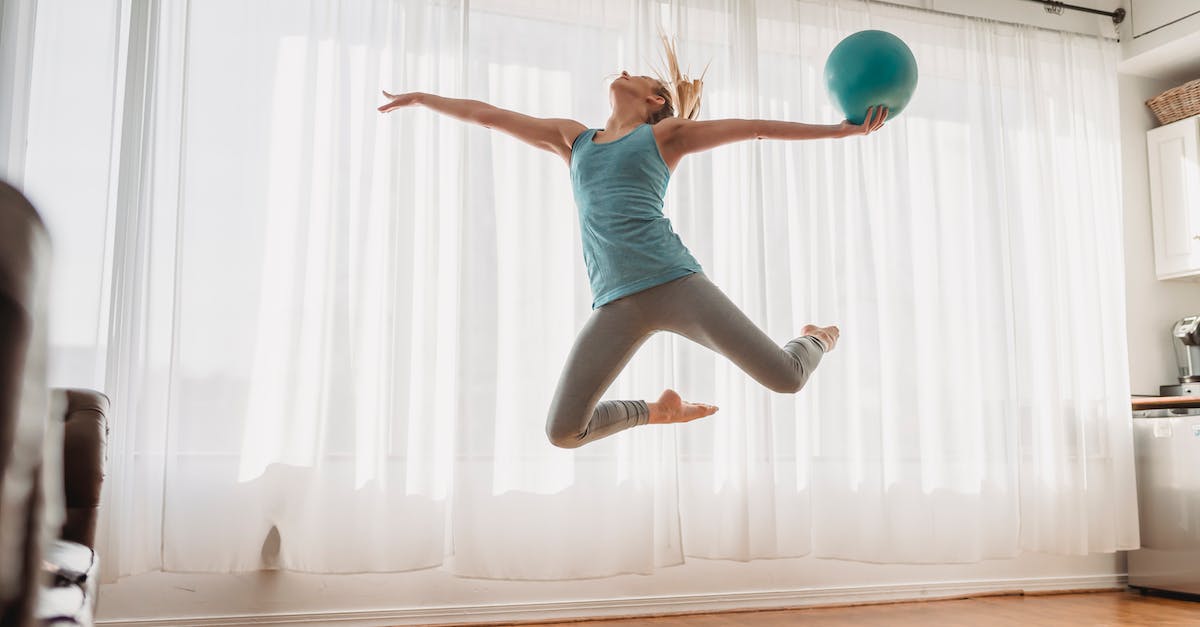 What are the requirements to get the floor jump? - Slim woman in sportswear jumping up with ball