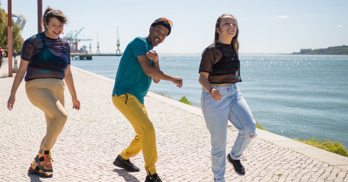 What are the requirements to have an acheivement pop? - Man in Black Shirt and Yellow Pants Holding Woman in Blue Shirt