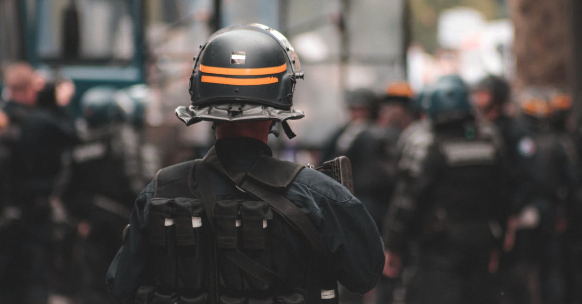 What are the special douchebag gear stats? - Back view of anonymous policeman in helmet and bulletproof vest maintaining law and order while standing on city street What are the special douchebag gear stats? - Back view of anonymous policeman in helmet and bulletproof vest maintaining law and order while standing on city street