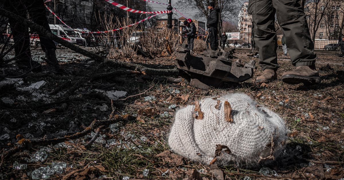 What are the specific rules impacting how much war weariness is applied to each city? - Knitted Hat Lying among Debris in Ukrainian City