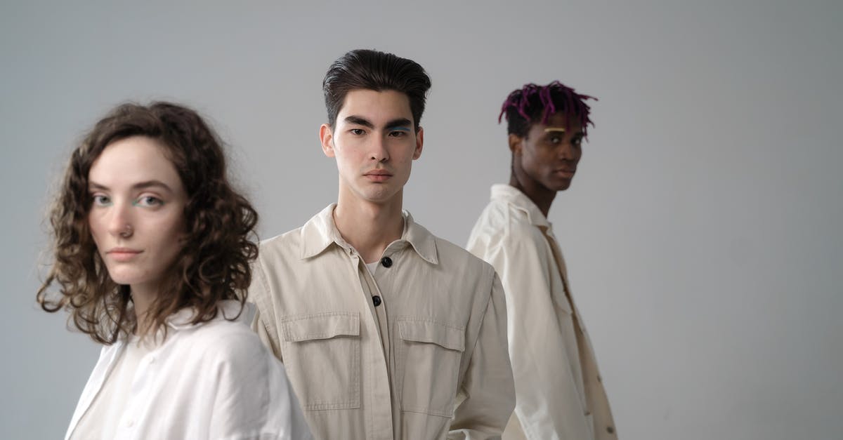 What are the standings for the different alien species? - Diverse young people in casual clothes looking at camera