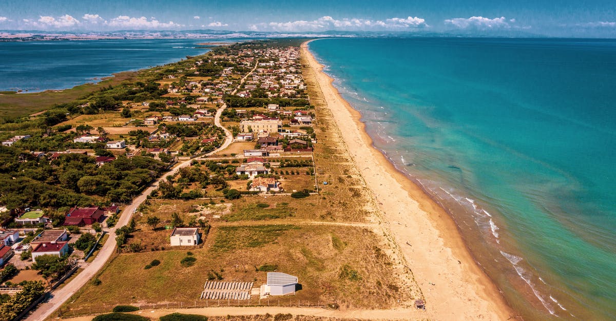 What are the storage and lodging capacities for the towns and cities in the game? - Aerial View of Beach