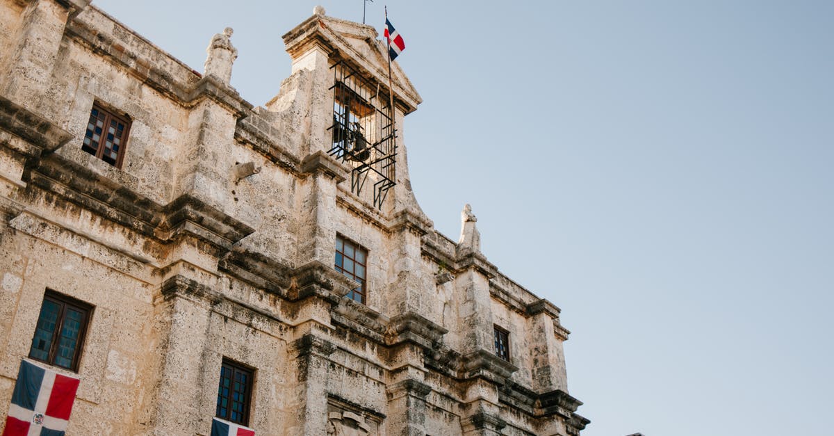What are the strongest combinations of Pantheon Spirits for AFK? - Facade of old building with flag of Dominican Republic