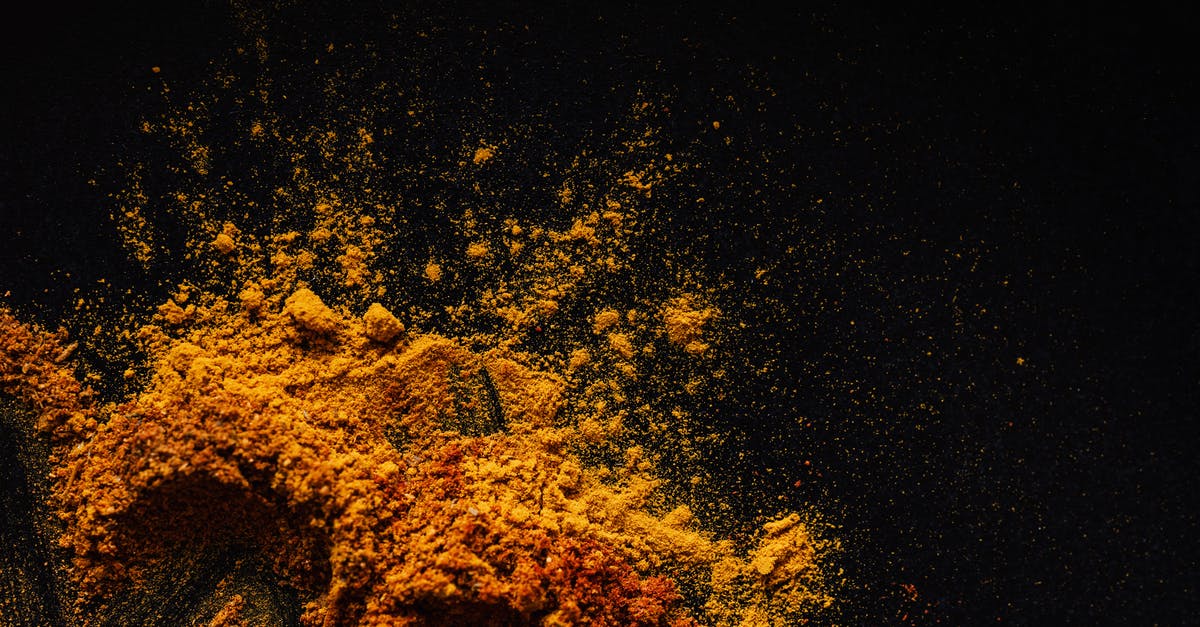 What are the various technicians and their effects? - Composition of multicolored ground spices spilled on black background