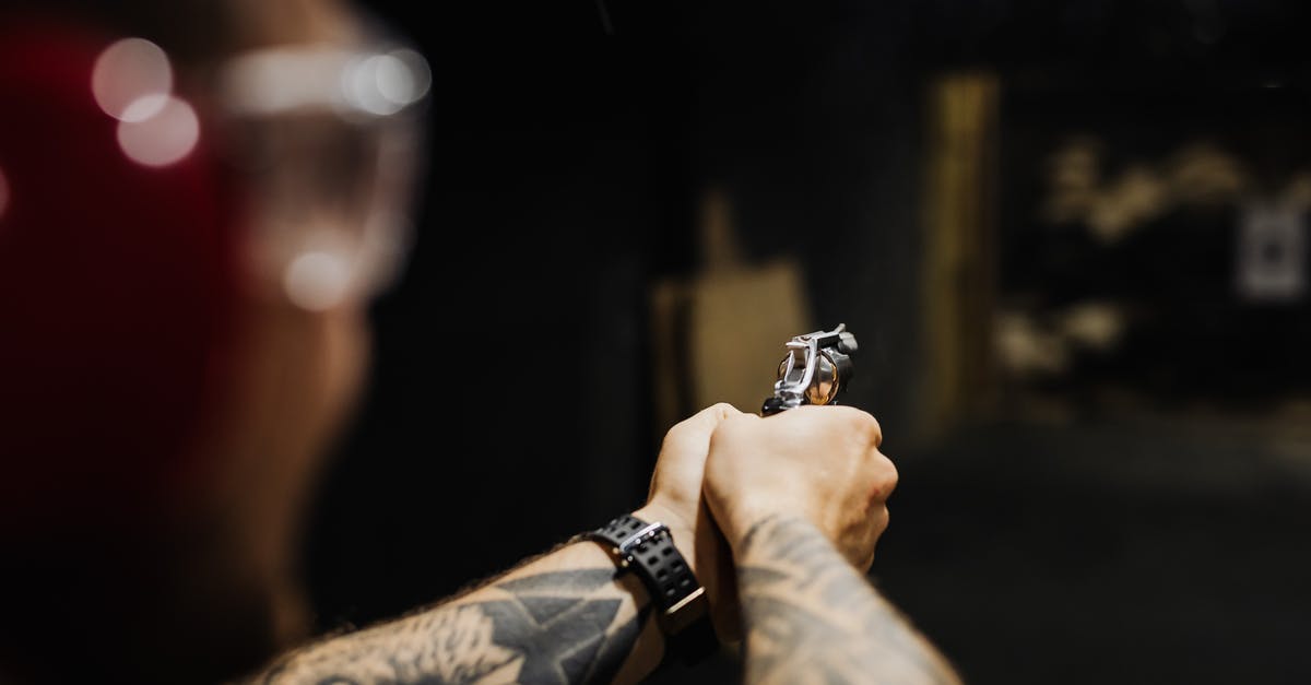 What are the weapon ranges? - Person Wearing Black Wristwatch Holding a Gun What are the weapon ranges? - Person Wearing Black Wristwatch Holding a Gun