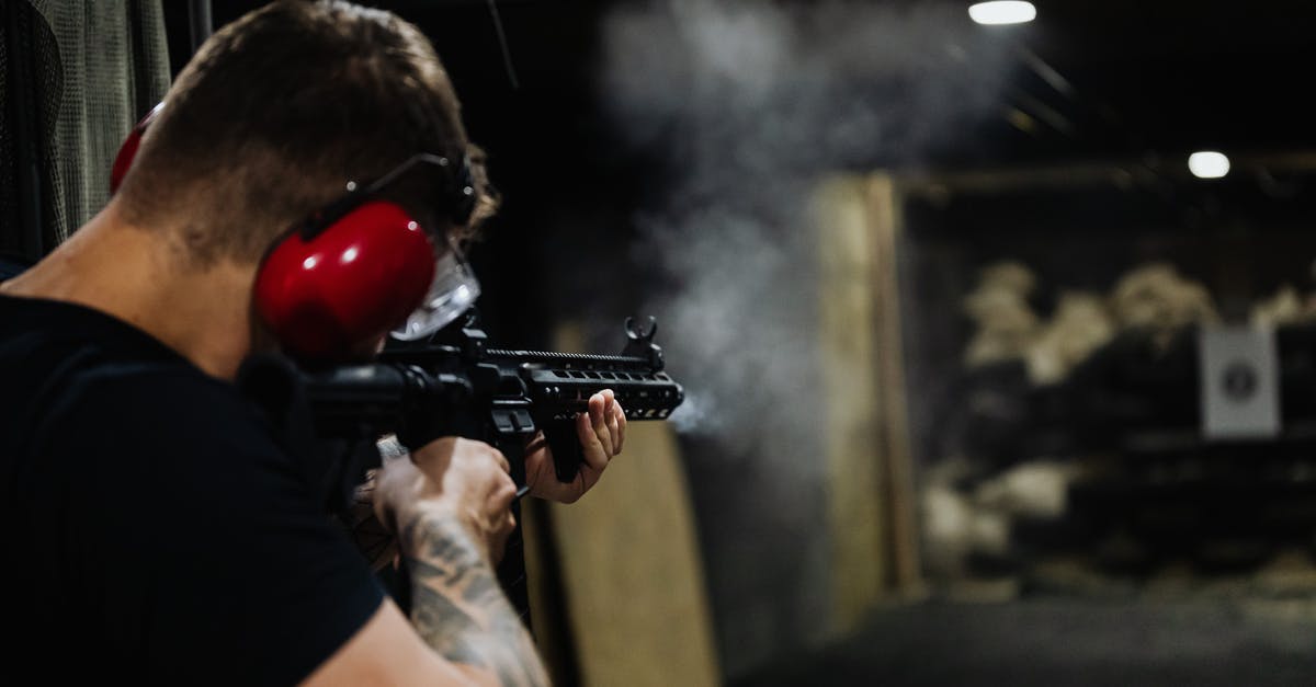 What are the weapon ranges? - Man in Black T-shirt Holding Black Assault Rifle What are the weapon ranges? - Man in Black T-shirt Holding Black Assault Rifle