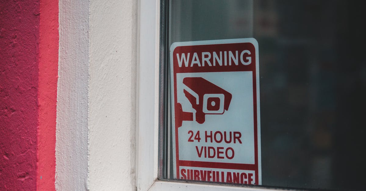 What are these red link icons? - Signboard video surveillance placed on window in daytime What are these red link icons? - Signboard video surveillance placed on window in daytime