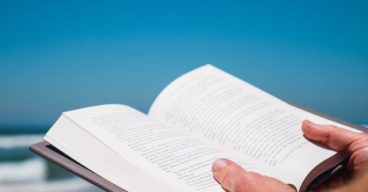 What are these thumbs up? - Person Holding a Book What are these thumbs up? - Person Holding a Book