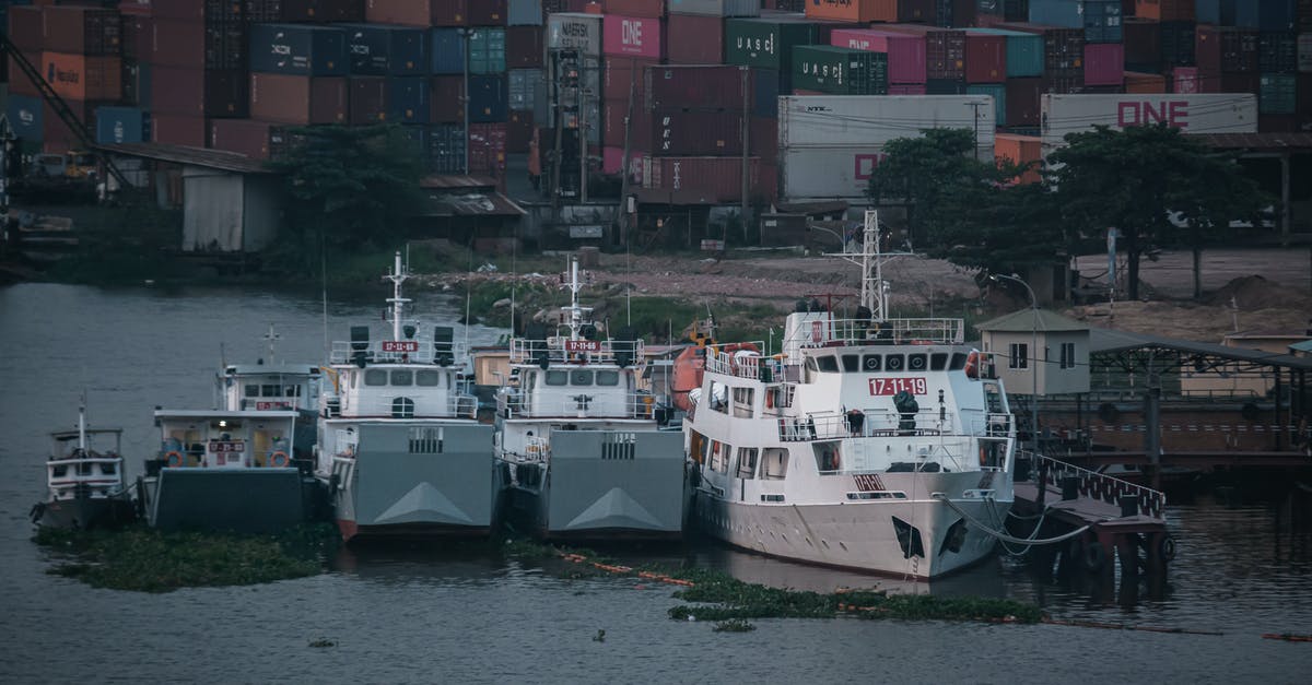 What are transported cargo limits for every vehicle? - White and Red Cargo Ship on Dock