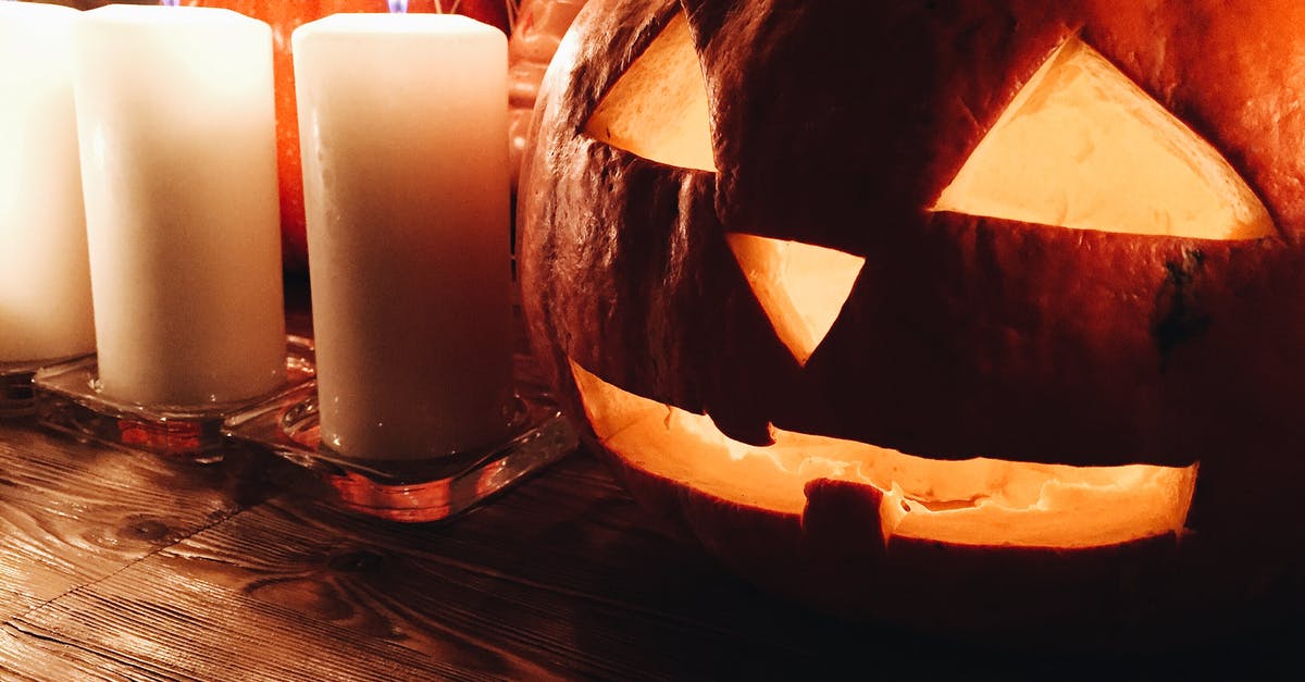What attribute values should I strive for? - Spooky carved Jack o lantern pumpkin placed on wooden table near burning candles during Halloween party What attribute values should I strive for? - Spooky carved Jack o lantern pumpkin placed on wooden table near burning candles during Halloween party