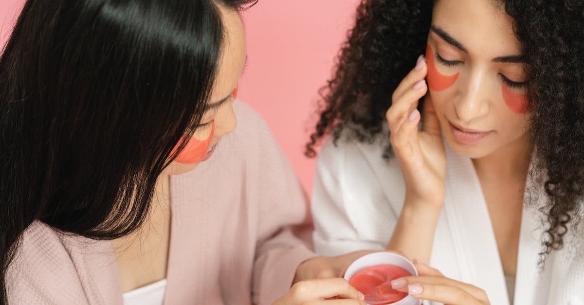 What blocks can you use to put under a beacon? - Two women using red cosmetic pads and putting them on under eyes What blocks can you use to put under a beacon? - Two women using red cosmetic pads and putting them on under eyes