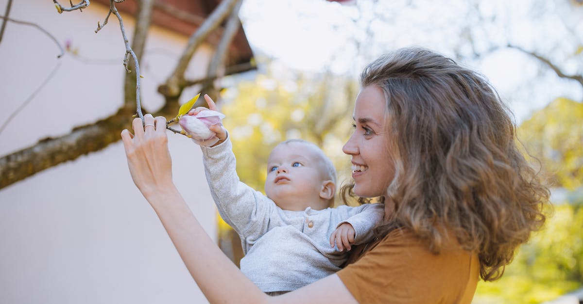What can be grabbed with the Advanced Grabbing Unit? - Woman and Baby Grabbing a Flower