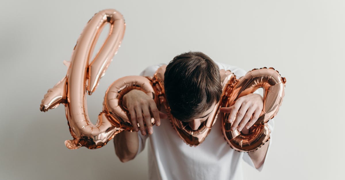 What can I do with a dead mouse, an inflatable bag and a charged battery? - Woman in White Shirt Covering Her Face With Brown and White Polka Dot Scarf