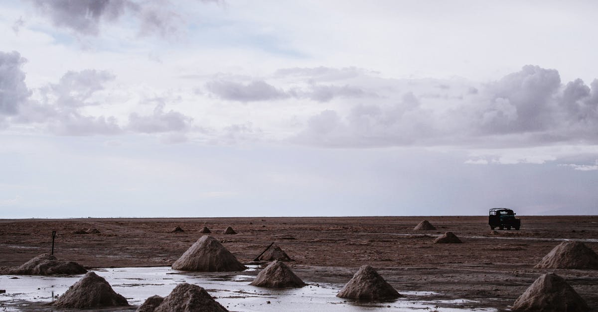 What car has the highest MPH in Forza Horizon 5? - Brown Rock Formation on Sea Under White Clouds
