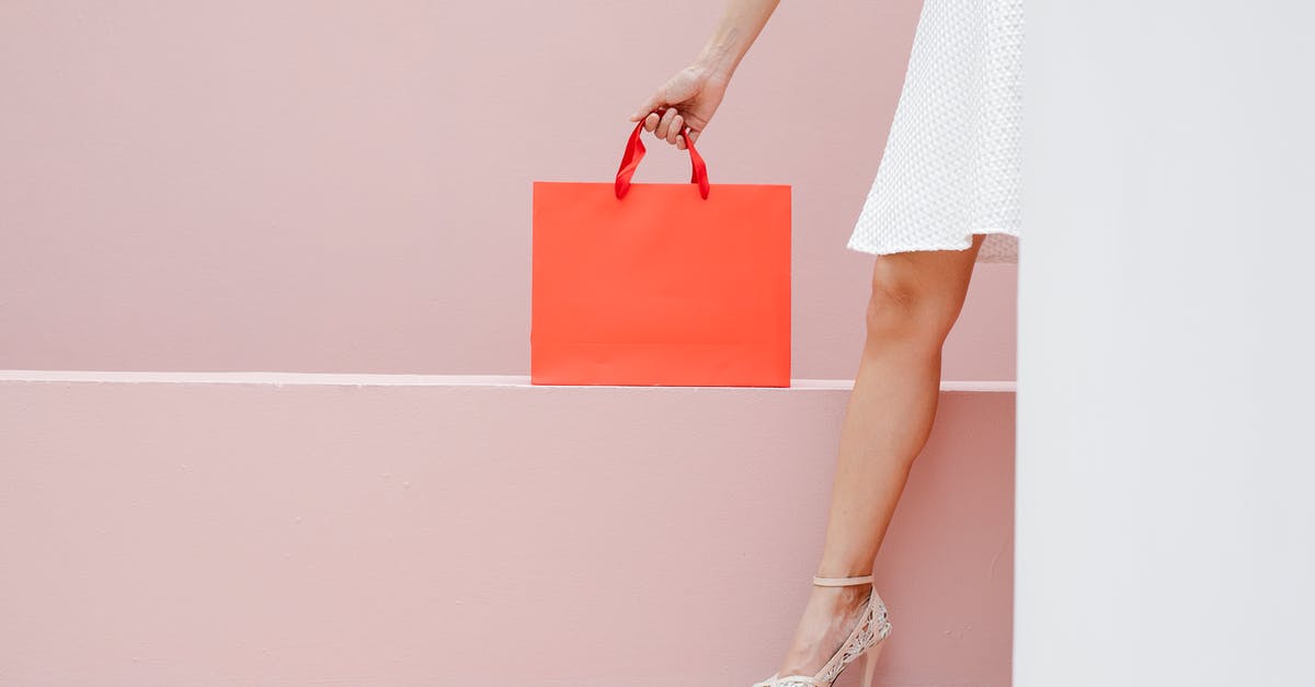 What causes the Badly Compressed Packet server error and how to avoid it? - Crop anonymous stylish female in white dress and high heels carrying red shopping bag against pink wall