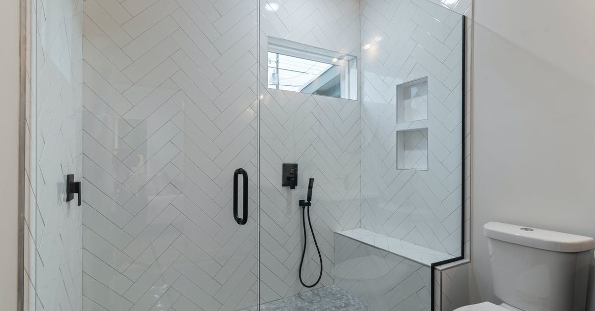 What change does the accessibility option make to the toilet minigames? - White Ceramic Bathtub Near Shower Stall What change does the accessibility option make to the toilet minigames? - White Ceramic Bathtub Near Shower Stall