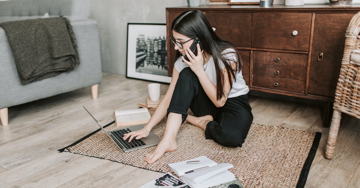 What cheat code do you use for spruce wood in Minecraft? - Woman Using Her laptop While Having A Conversation Over The Phone