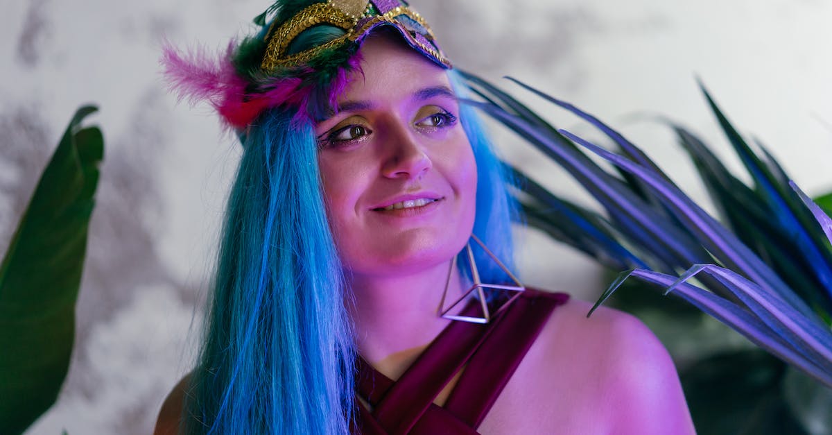 What costume am I missing? - Woman in Blue Hair Wearing Purple Tank Top What costume am I missing? - Woman in Blue Hair Wearing Purple Tank Top