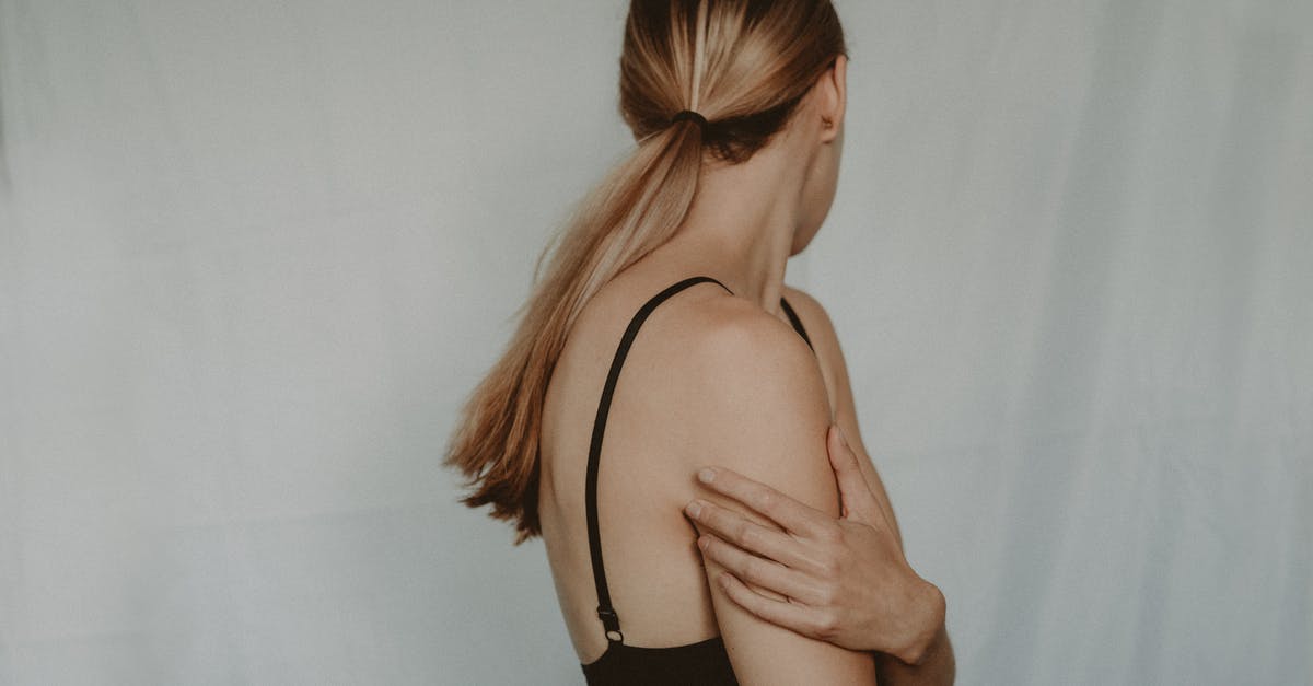 What could be causing Roblox Experiences to fail to start? - Side view of unrecognizable young female with long hair and black bra standing near grey wall turning head away What could be causing Roblox Experiences to fail to start? - Side view of unrecognizable young female with long hair and black bra standing near grey wall turning head away