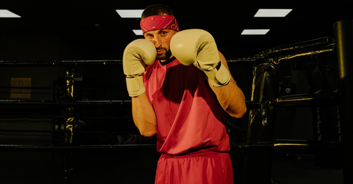 What criteria to look for when placing pokemon to defend gyms? - Serious young male boxer training on ring