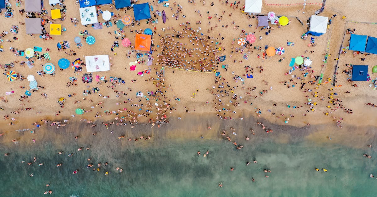 What determines how many catapults spawn in a lane? - Aerial top view of people spreading on seashore preparing for swim competition in summertime What determines how many catapults spawn in a lane? - Aerial top view of people spreading on seashore preparing for swim competition in summertime