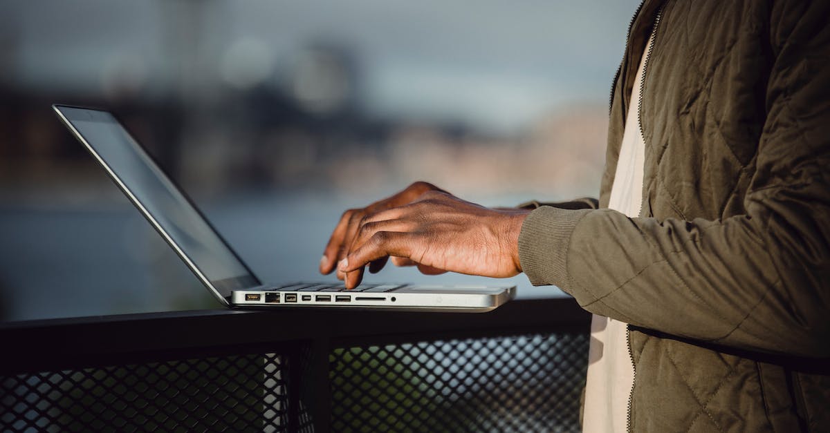 What determines if a city's population uses resource squares or becomes worker in the city? - Crop man working on laptop on open terrace What determines if a city's population uses resource squares or becomes worker in the city? - Crop man working on laptop on open terrace