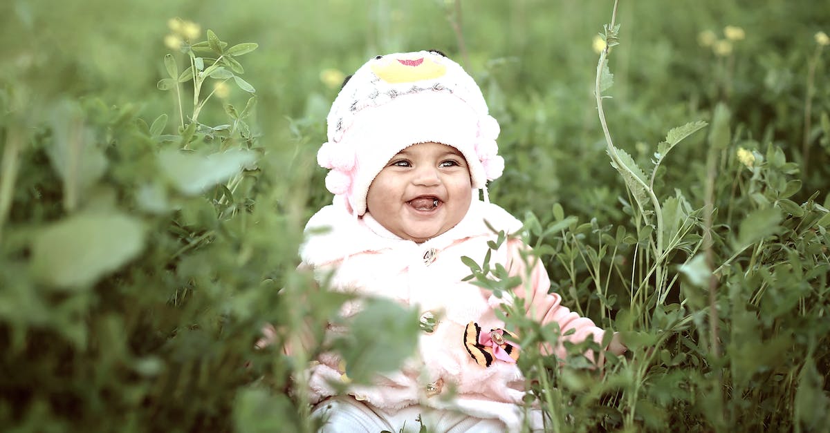 What determines SPECIAL inheritance in children? - Toddler Wearing Whit Cap on Green Field