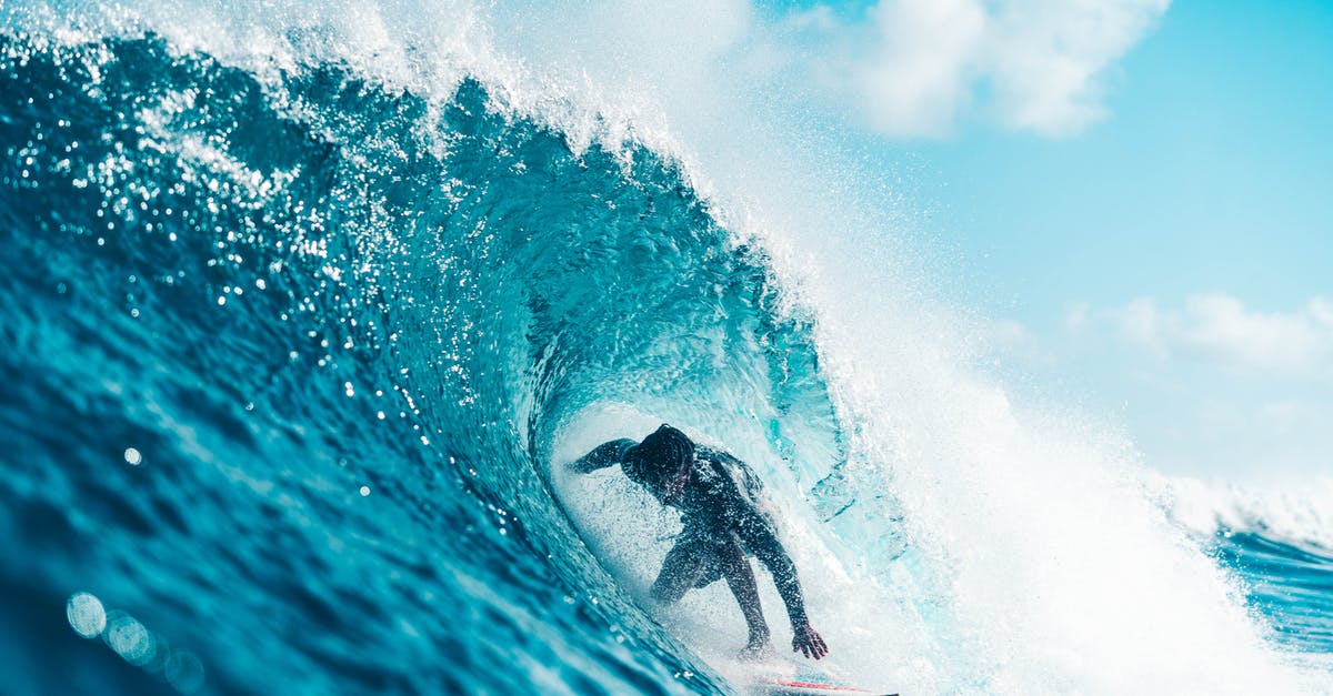 What determines the final move after triggering Velvet's arm? - Unrecognizable energetic surfer riding azure sea wave