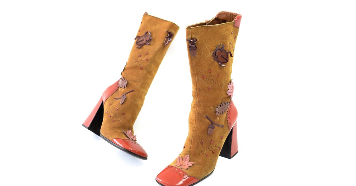 What determines the quality of crafting materials gathered? - Pair of vintage suede brown boots with leather heels and nose decorated with tree leaves and bugs placed on white surface