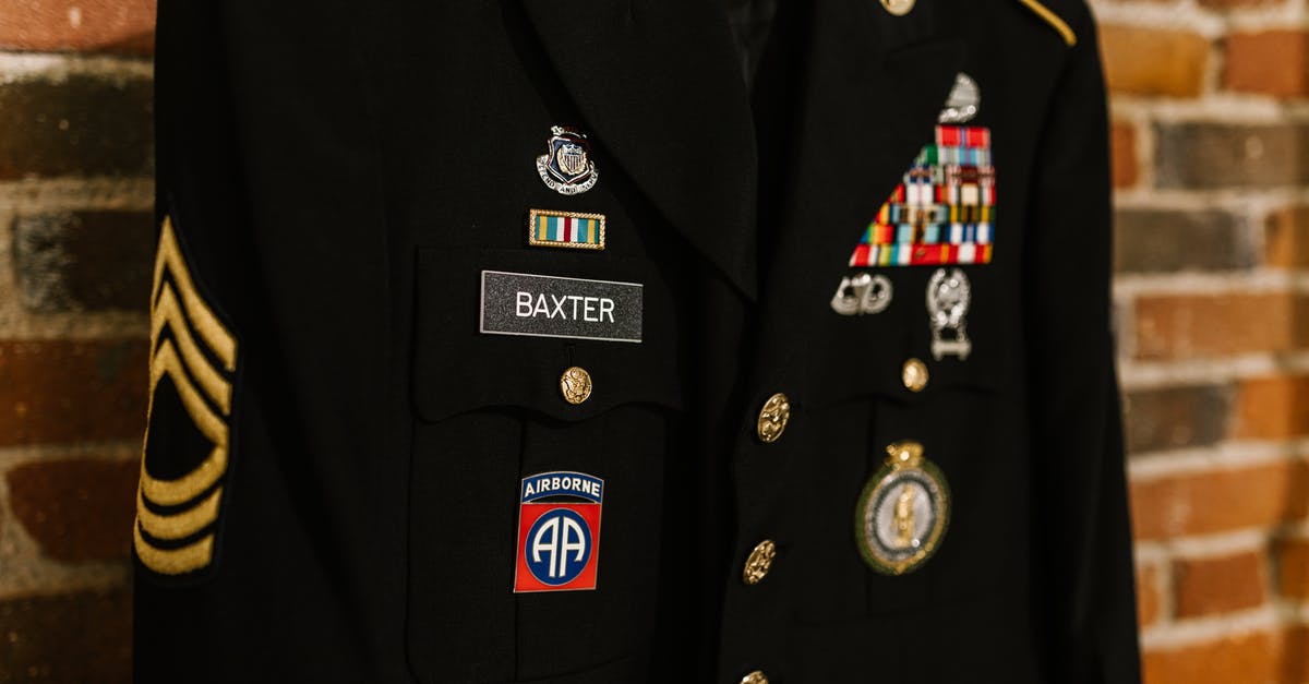 What determines the rank of a new soldier rewarded from a mission? - Close-Up Photo of Military Coat What determines the rank of a new soldier rewarded from a mission? - Close-Up Photo of Military Coat