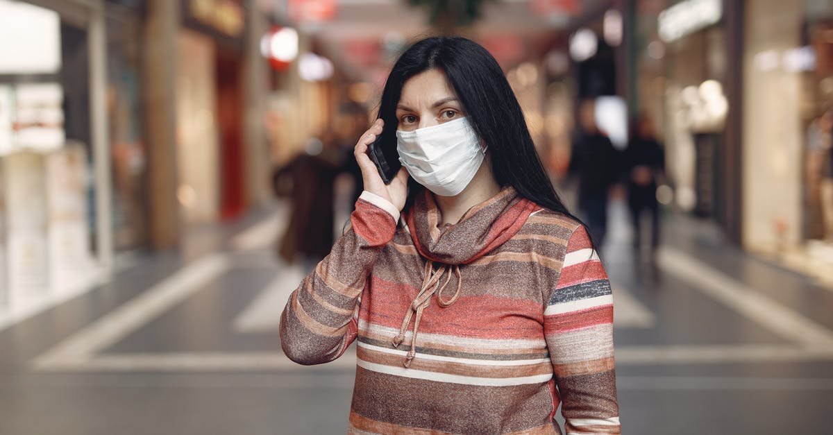 What determines which character gets to use a summon? - Worried casual female wearing protective mask and looking at camera while answering phone call against blurred background in city center during coronavirus pandemic
